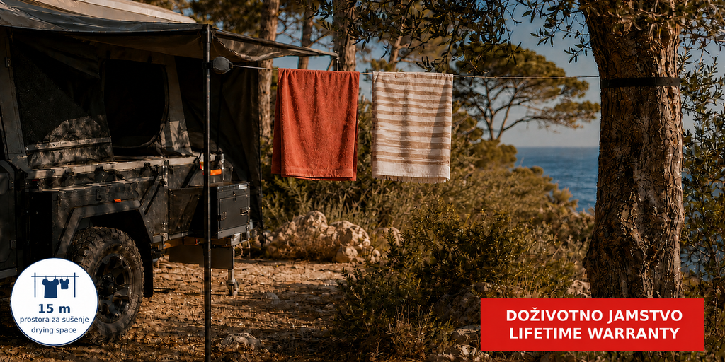 Hills Single Retractable Clothesline with 15 m drying line in use beside a camping vehicle.