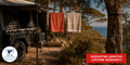 Hills Single Retractable Clothesline with 15 m drying line in use beside a camping vehicle.