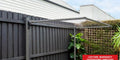 Hills Folding Frame Post Kit in Monument installed in a landscaped courtyard.