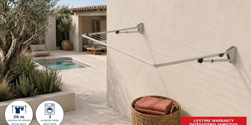 Hills Single Folding Frame Clothesline in Surfmist mounted in a modern courtyard with towels drying on the lines.