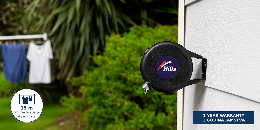 Hills Cordomatic Retractable Clothesline with 15 m drying line in black in use with laundry drying on the lines.