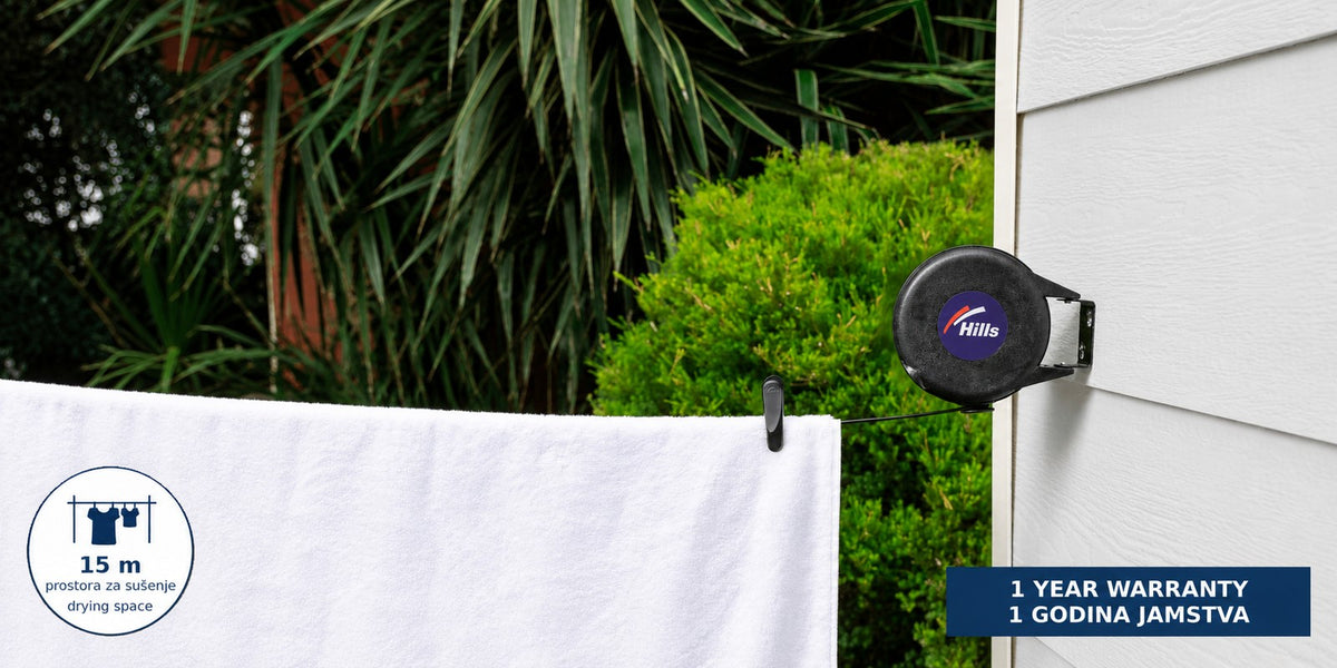Hills Cordomatic Retractable Clothesline with 15 m drying line in black with its retractable drying line fully extended.
