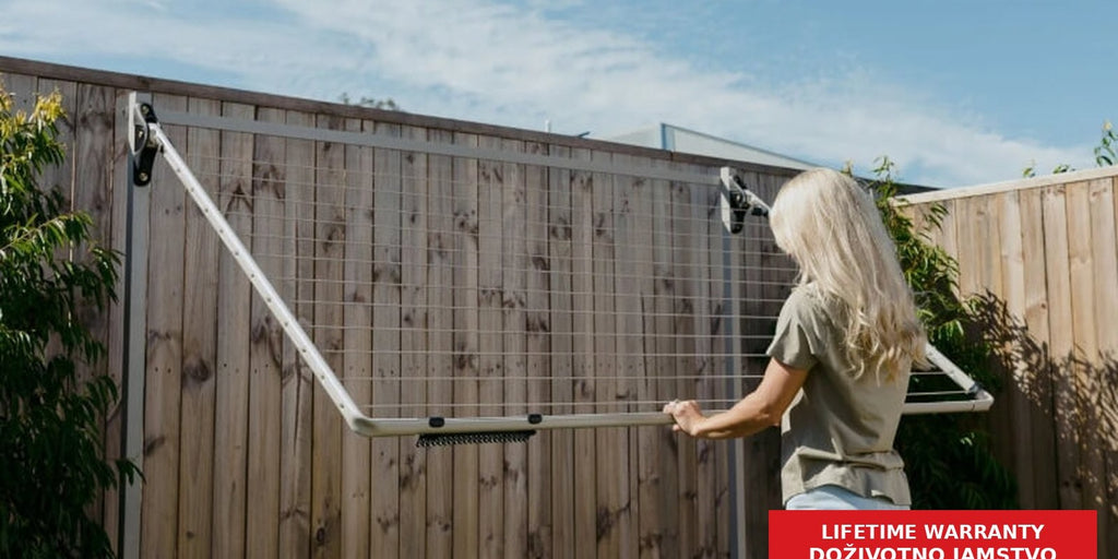 Hills Folding Frame Post Kit supporting a light-coloured folding clothesline in use.