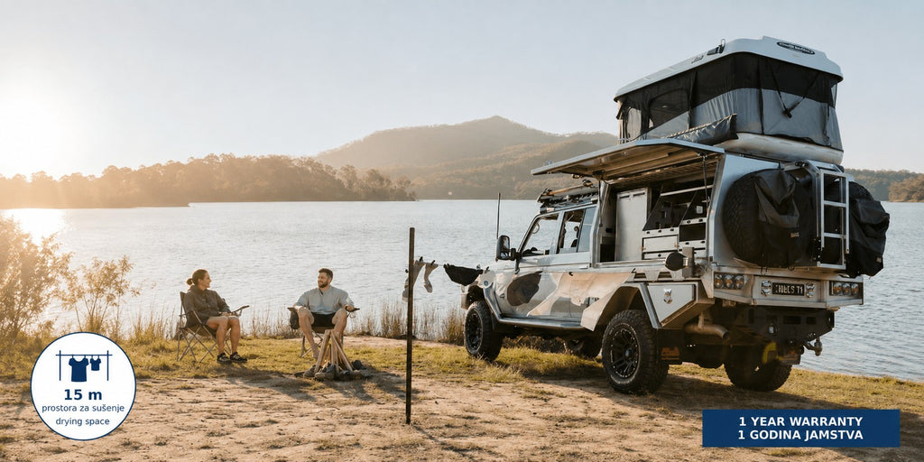 Hills Cordomatic Retractable Clothesline with 15 m drying line in black in use beside a camping vehicle.