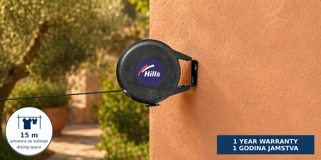 Hills Cordomatic Retractable Clothesline with 15 m drying line in black mounted on a terracotta exterior wall with the retractable line ready for use.