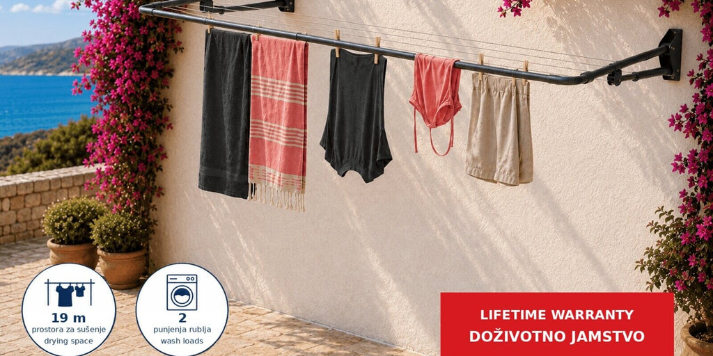 Hills Compact Folding Frame Clothesline – Monument mounted on an exterior wall framed by bougainvillea.