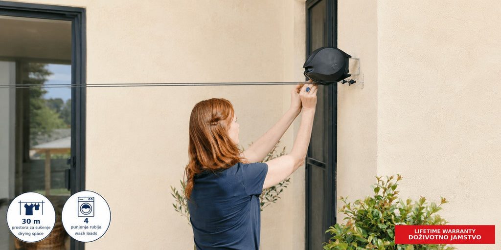Hills Double Retractable Clothesline with 30 m drying space in use with laundry drying on the lines.